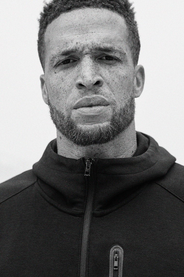 Black and white portrait of athletic man with freckles