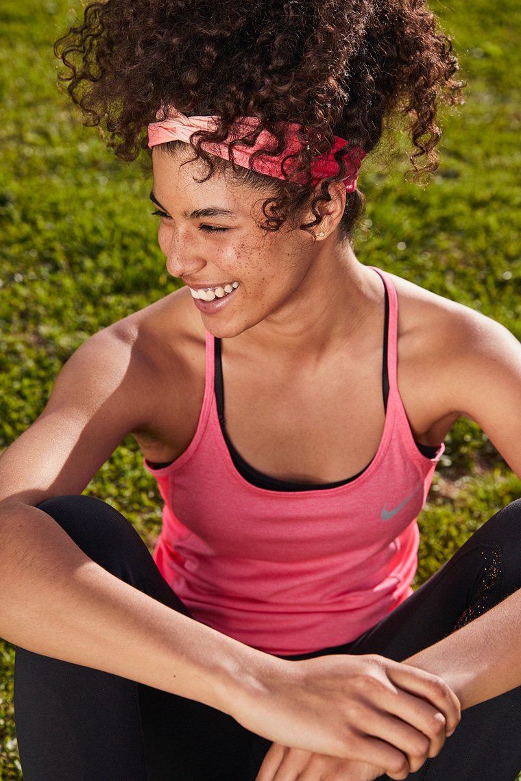 Candid portrait of woman in activewear laughing